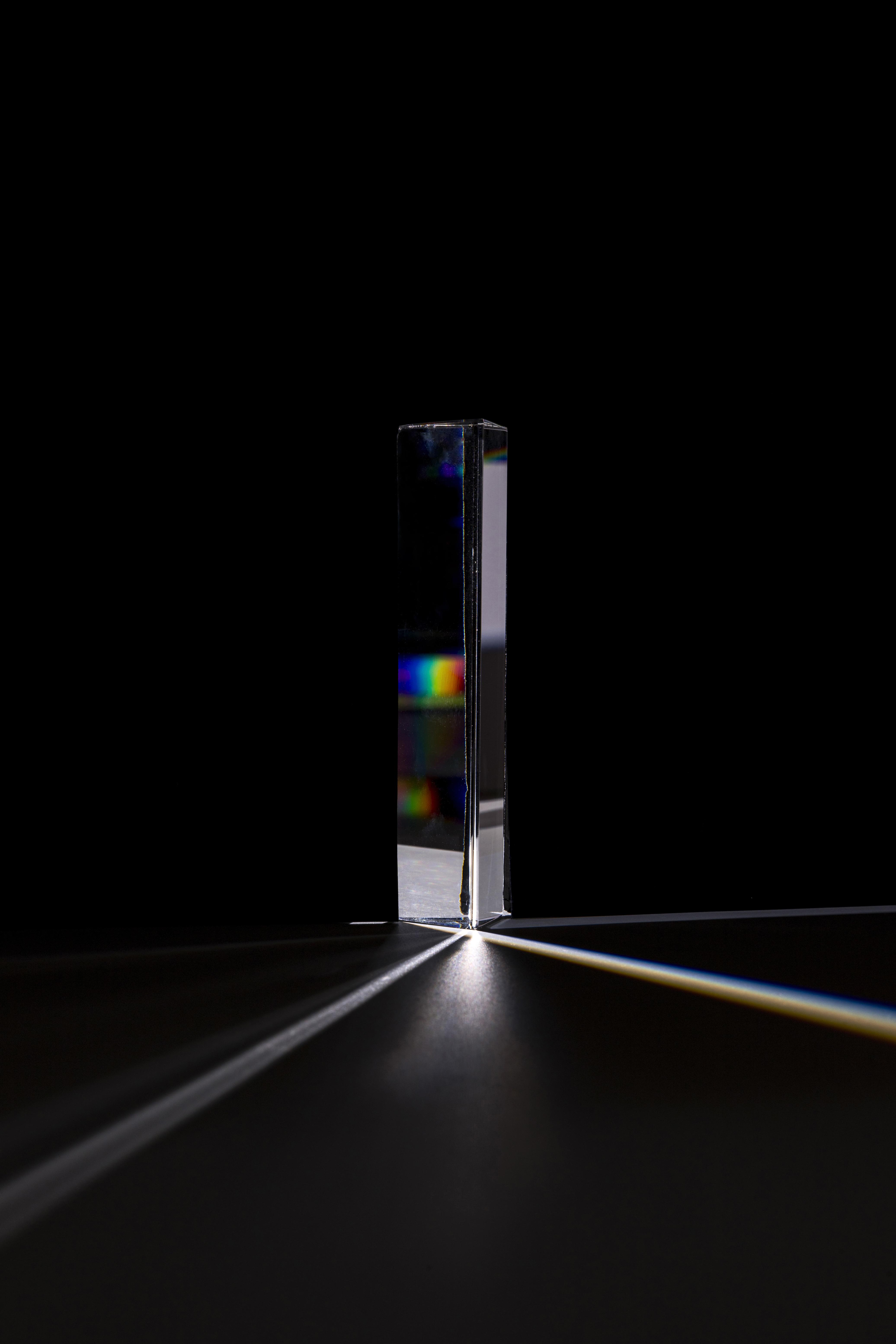 Light splitting into a spectrum through a glass prism